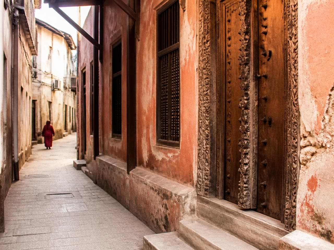 Carved wooden doors and coral-stone walls in Stone Town, Zanzibar